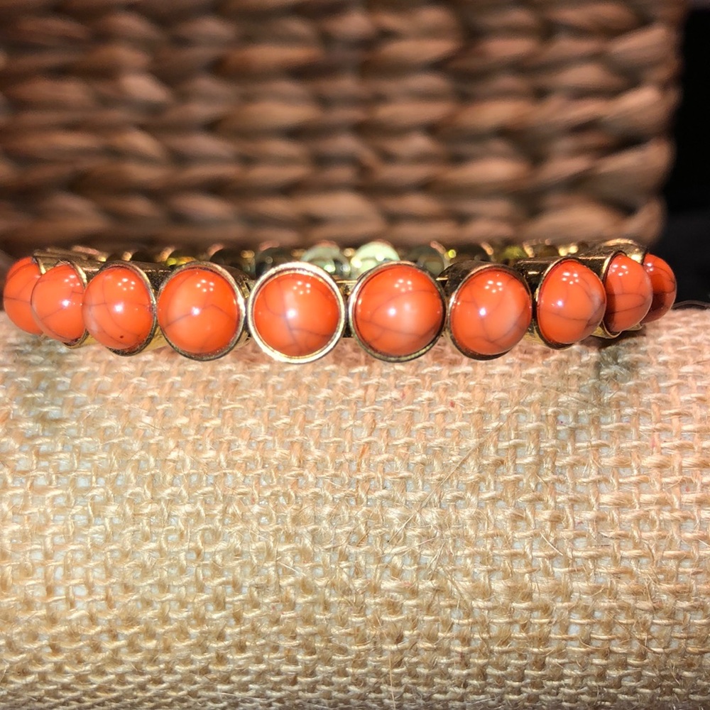 Bangle with faux orange stones